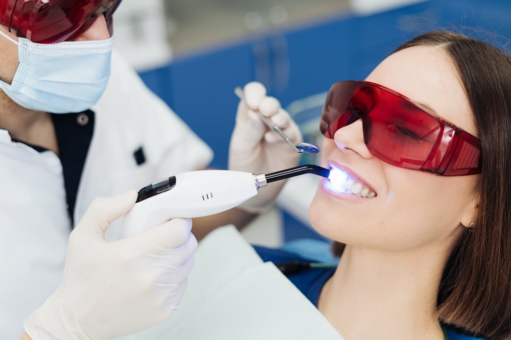 Patient Receiving Advanced Laser Dental Treatment – Laser Dentistry in Torrance CA A patient wears protective glasses while receiving a modern laser dental procedure designed to improve comfort, precision, and faster healing times. – Laser Dentistry in Torrance CA