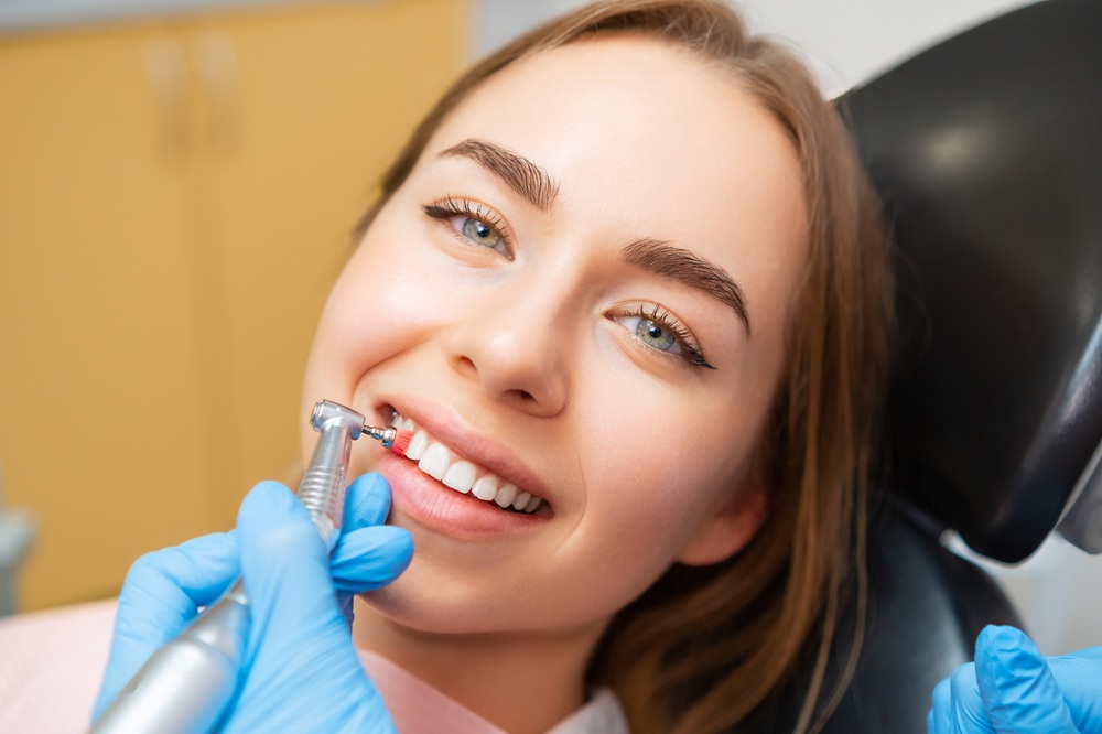 A patient receives a gentle professional dental cleaning, promoting healthy gums and a bright, confident smile - Dentist in San Pedro CA