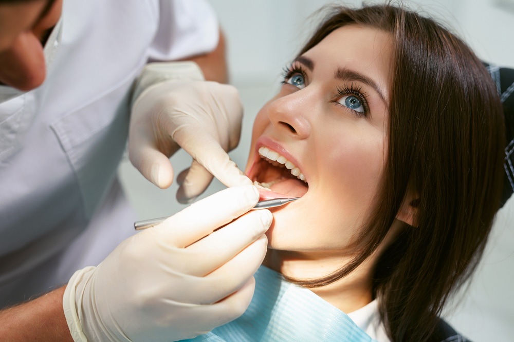 A patient undergoing a gentle dental examination using modern tools to ensure optimal oral health and comfort – Dentist in Palos Verdes.