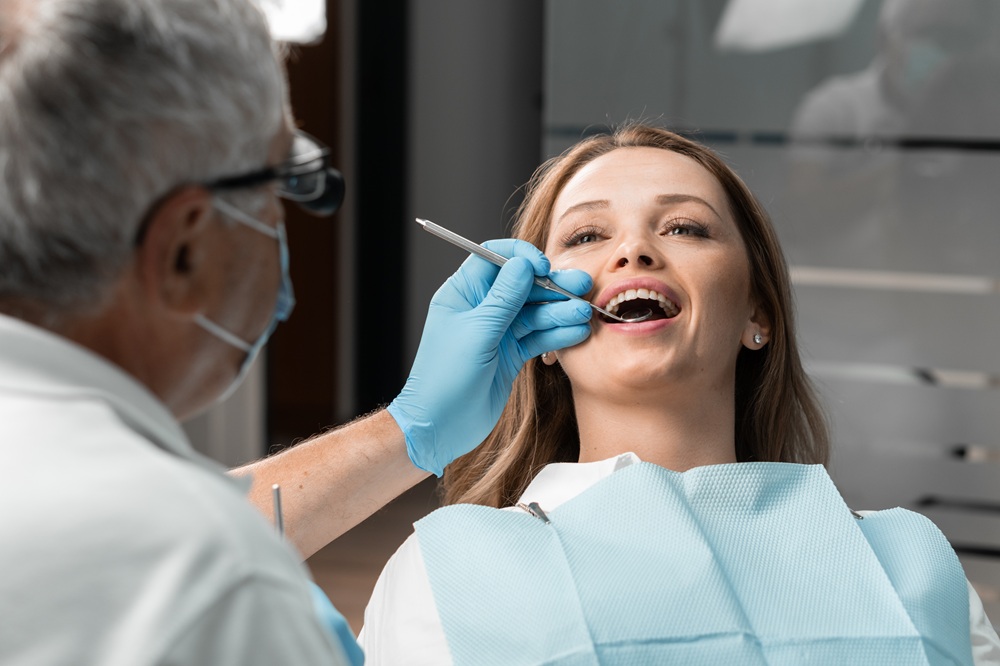 A female patient receiving a professional dental checkup, emphasizing preventive care and gentle treatment in a comfortable setting – Dentist in Redondo Beach.