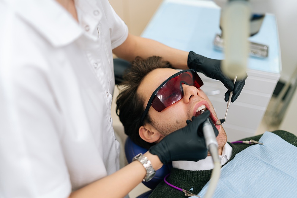 Comfortable Laser Dental Treatment in Modern Clinic – Laser Dentistry in Torrance CA A dental professional performs a precise laser procedure to treat teeth and gums, offering minimally invasive care with improved patient comfort. – Laser Dentistry in Torrance CA