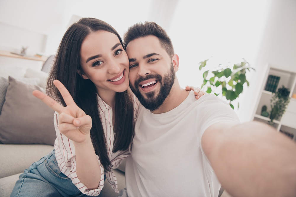 Happy Couple Showing Bright Smiles After Treatment – Laser Dentistry in Torrance CA A smiling couple takes a selfie after completing advanced laser dental treatments, celebrating healthier, brighter smiles with modern technology. – Laser Dentistry in Torrance CA