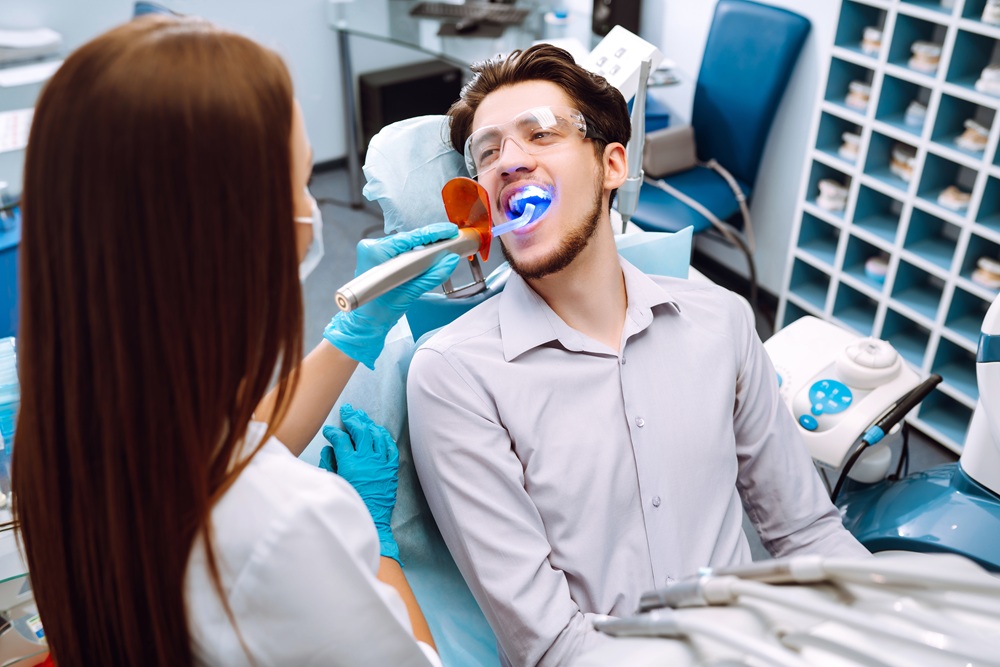 A patient receiving advanced teeth whitening treatment in a modern dental office for a brighter, more confident smile – Dentist in Palos Verdes.