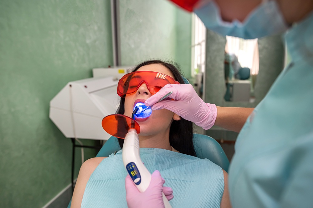 A patient wearing protective glasses while receiving advanced laser teeth whitening treatment for a brighter smile – Dentist in Torrance CA.