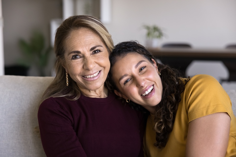 A happy mother and daughter sharing a warm smile, highlighting the importance of family dental care and maintaining healthy smiles at every stage of life – Dentist in Palos Verdes.