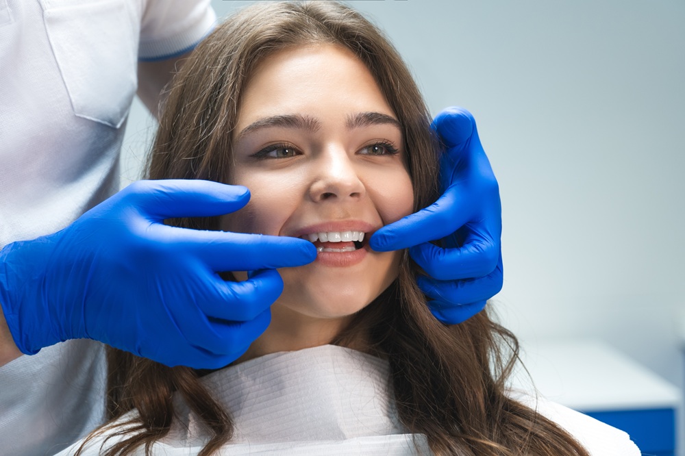 A dental hygienist carefully examines a patient’s teeth during a preventive cleaning appointment, ensuring optimal oral health and long-lasting results. – Dental Cleaning in Torrance CA